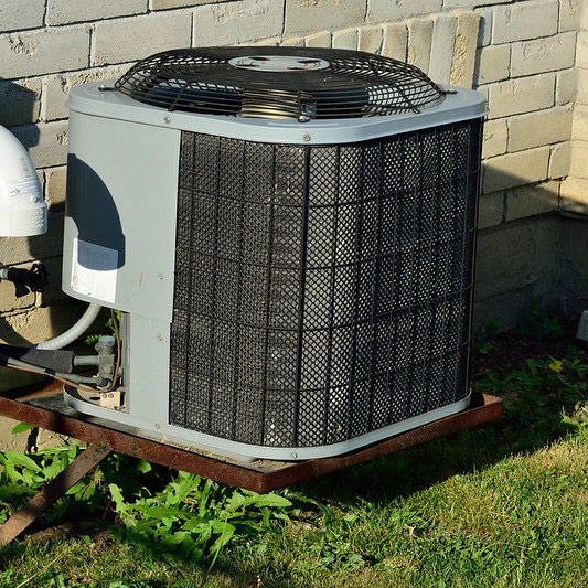 AC unit and heat pump outside